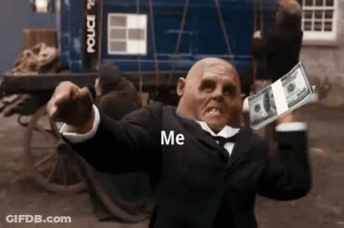 A Man In A Suit Is Holding A Stack Of 100 Dollar Bills In His Hand . GIF