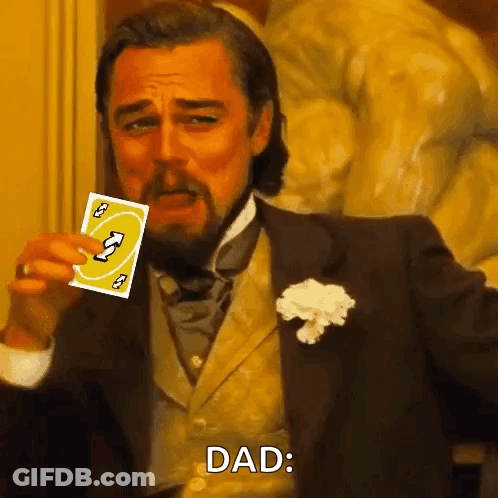 A Man In A Suit Is Holding A Uno Card In His Hand And Says Dad . GIF