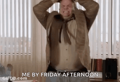 A Man In A Suit Is Holding His Head In His Hands And Screaming . GIF