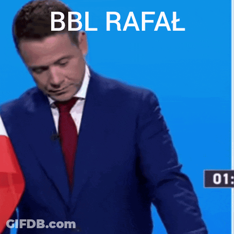 A Man In A Suit Is Kneeling At A Podium With The Words Bbl Rafal Written Above Him GIF