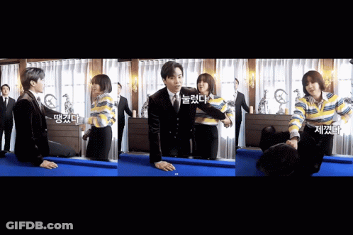 A Man In A Suit Is Kneeling On A Pool Table With A Woman GIF