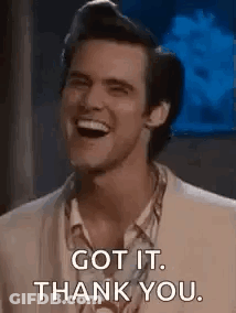 A Man In A Suit Is Laughing And Saying `` Got It , Thank You '' . GIF