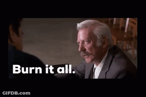A Man In A Suit Is Laughing With The Words Burn It All Behind Him GIF