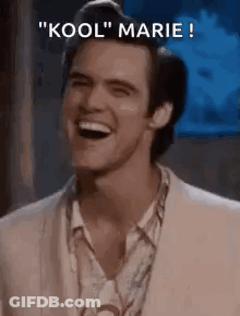 A Man In A Suit Is Laughing With The Words `` Kool '' Marie Written Above Him . GIF
