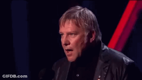 A Man In A Suit Is Making A Funny Face And Says Blah Blah Blah Blah Blah Blah Blah Blah GIF
