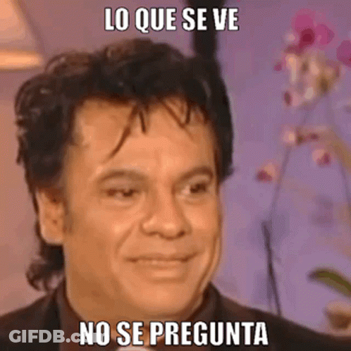 A Man In A Suit Is Making A Funny Face With A Meme . GIF