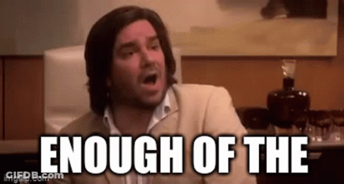 A Man In A Suit Is Making A Funny Face With The Words `` Enough Of The '' Written Above Him . GIF
