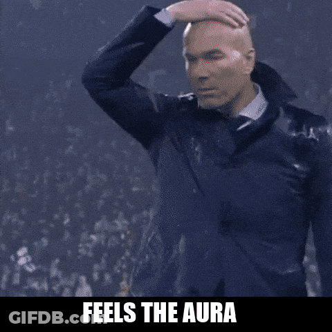 A Man In A Suit Is Making A Funny Face With The Words " Feels The Aura " Above Him GIF