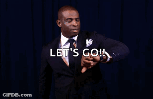 A Man In A Suit Is Pointing At His Watch With The Words Let 'S Go You Know What Time It Is GIF
