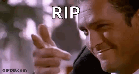 A Man In A Suit Is Pointing His Finger At The Camera And Saying `` Rip '' . GIF