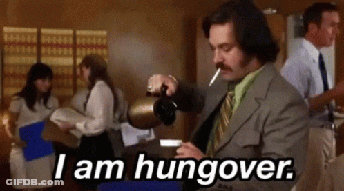 A Man In A Suit Is Pouring Coffee Into A Cup While Smoking A Cigarette And Saying `` I Am Hungover '' GIF