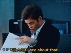 A Man In A Suit Is Reading A Piece Of Paper And Saying We Shall See About That GIF