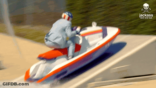 A Man In A Suit Is Riding A Jet Ski With The Words Jack Best And Fast Written On The Bottom GIF