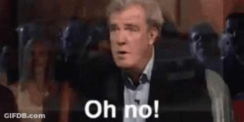 A Man In A Suit Is Saying Oh No . GIF