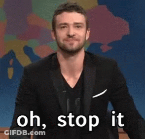 A Man In A Suit Is Saying " Oh , Stop It " GIF