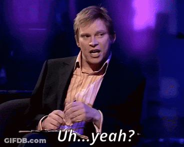 A Man In A Suit Is Saying Uh Yeah While Holding A Pen GIF