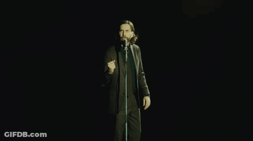 Man In Suit Singing Into Microphone GIF