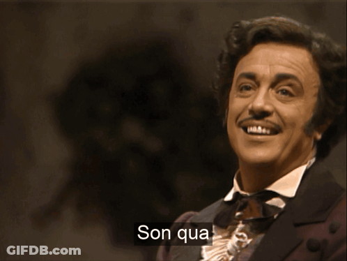 A Man In A Suit Is Singing With The Words Son Qua Written On The Bottom GIF