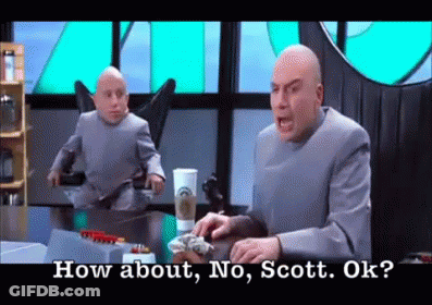 A Man In A Suit Is Sitting At A Table And Talking To A Smaller Man In A Suit . GIF