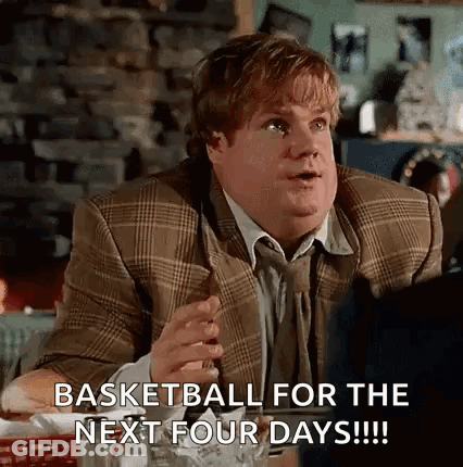 A Man In A Suit Is Sitting At A Table With A Glass Of Beer And A Cigarette In His Hand . GIF
