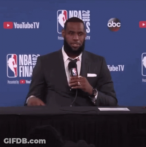 Man In Suit At NBA Finals Table GIF