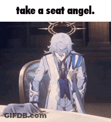 A Man In A Suit Is Sitting At A Table With The Words Take A Seat Angel On The Bottom . GIF