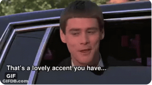 A Man In A Suit Is Sitting In A Car And Says That 'S A Lovely Accent You Have . GIF