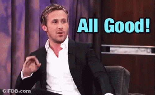 A Man In A Suit Is Sitting In A Chair With The Words All Good Behind Him GIF