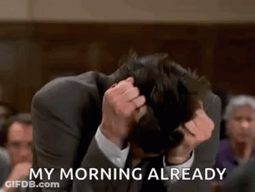 A Man In A Suit Is Sitting In A Courtroom With His Head In His Hands And Says `` My Morning Already '' . GIF