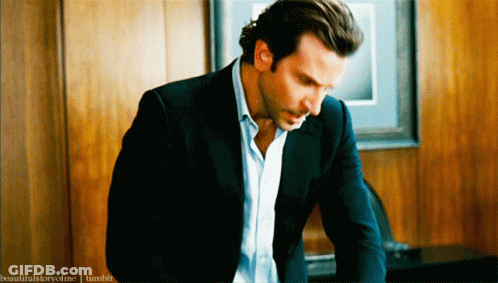 A Man In A Suit Is Sitting In Front Of A Wooden Wall And The Words Beautifulstoryofme Tumblr Can Be Seen Behind Him GIF