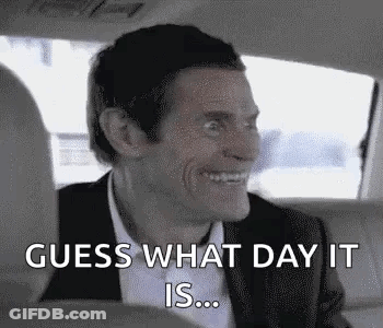 A Man In A Suit Is Sitting In The Back Seat Of A Car . GIF