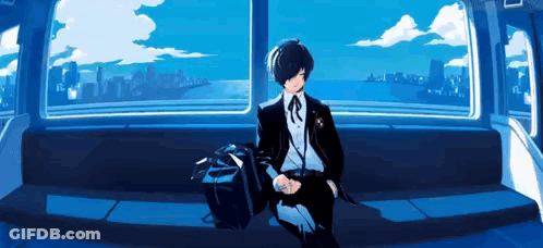 A Man In A Suit Is Sitting On A Bench In Front Of A Window With A View Of The Ocean . GIF