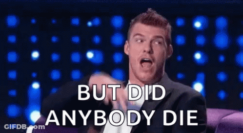 A Man In A Suit Is Sitting On A Couch And Saying `` But Did Anybody Die '' GIF