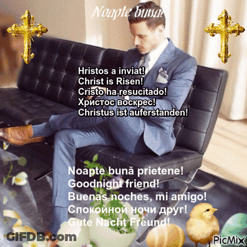 A Man In A Suit Is Sitting On A Couch With A Picture Of A Chick And A Cross Behind Him GIF