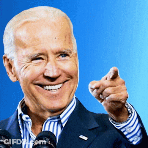Man In Suit Smiling And Pointing GIF
