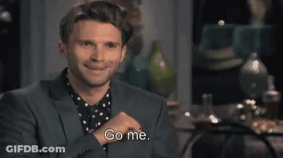 A Man In A Suit Is Smiling And Saying Go Me . GIF