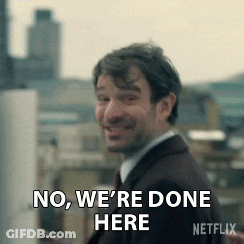 A Man In A Suit Is Smiling And Says No , We 'Re Done Here . GIF