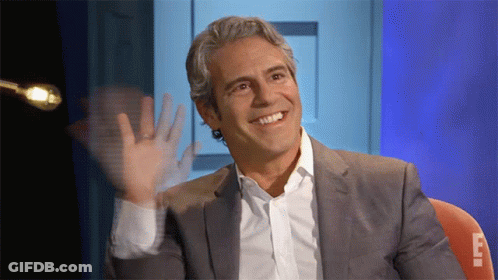 Smiling Man In Suit Waving GIF