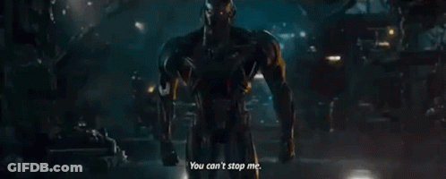 Man In Suit Talking In Dark Room GIF