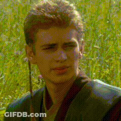 A Man In A Suit Is Standing In A Field Of Grass GIF