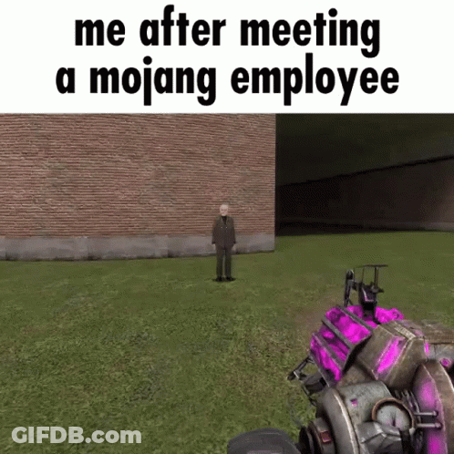 A Man In A Suit Is Standing In A Grassy Field In Front Of A Brick Building In A Video Game . GIF