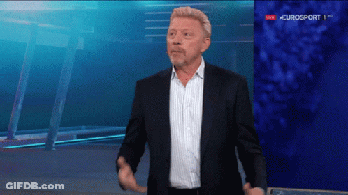 A Man In A Suit Is Standing In Front Of A Eurosport Sign GIF