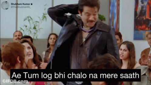 A Man In A Suit Is Standing In Front Of A Group Of People With The Caption Ae Tum Log GIF