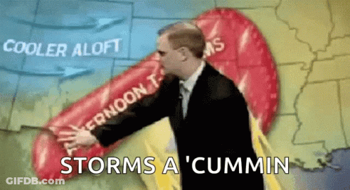 A Man In A Suit Is Standing In Front Of A Map That Says Storms A ' Cummin ' GIF