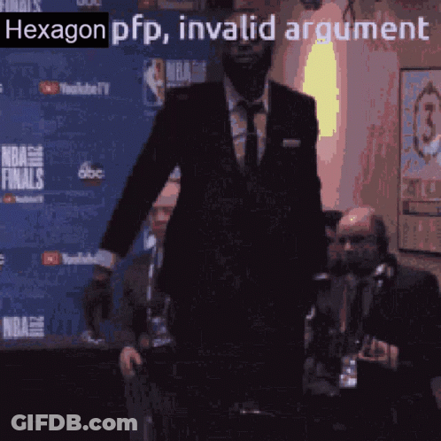 A Man In A Suit Is Standing In Front Of A Nba Finals Banner GIF