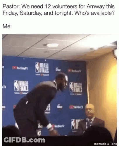 A Man In A Suit Is Standing In Front Of A Nba Finals Sign GIF