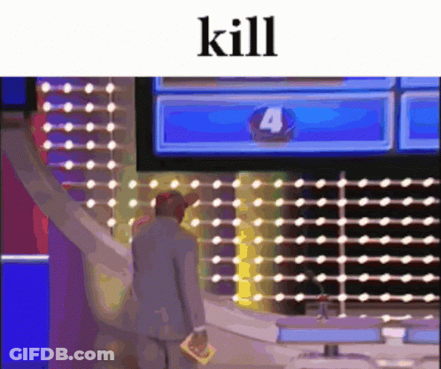 A Man In A Suit Is Standing In Front Of A Screen With The Number Four On It . GIF
