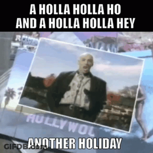 A Man In A Suit Is Standing In Front Of A Sign That Says A Holla Holla Ho And A Holla Holla Hey GIF