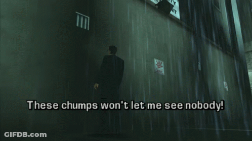 A Man In A Suit Is Standing In Front Of A Wall That Says These Chumps Won T Let Me See Nobody GIF
