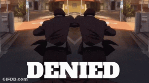 A Man In A Suit Is Standing In Front Of The Word Denied GIF